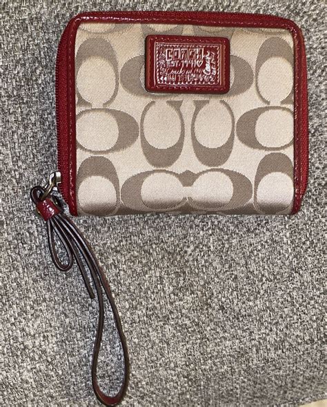 coach wallet with wrist strap.